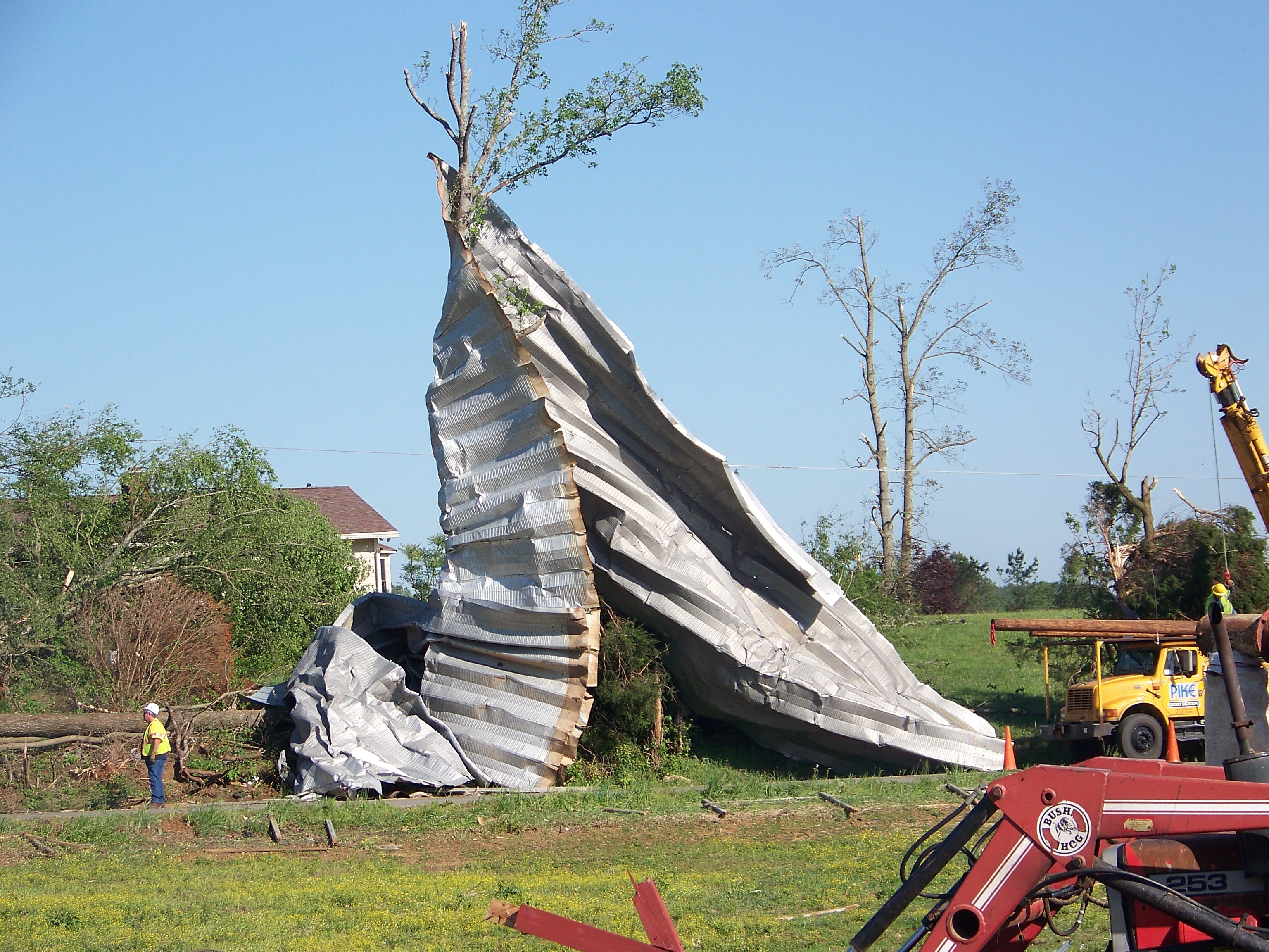 webassets/Metal_barn_in_neighbors_tree.JPG